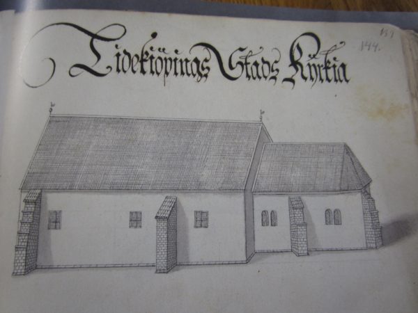 Uppslaget visar teckning av Lidköpings stads kyrka